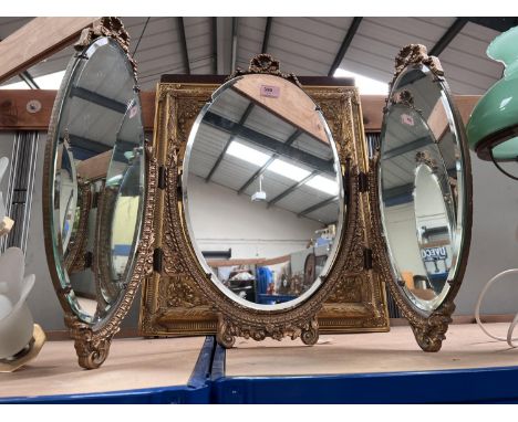 A gilt triple dressing table mirror, a converted table lamp with opaque glass and shade 