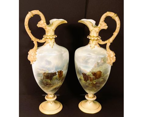 A Royal Worcester pair of pedestal ewers of ovoid tapering form, decorated with highland cattle in naturalistic settings, sig