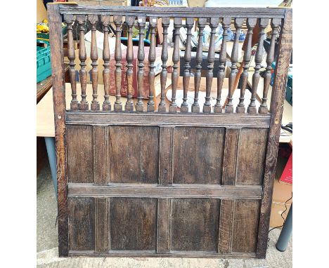 An oak panel with turned columns to the top and panelled decoration; an oak bureau bookcase 