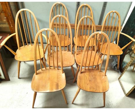 Ercol Furniture: A set of 8 (6+2 carver chairs) Ercol blonde beech and elm high hoop back dining chairs with rounded legs and