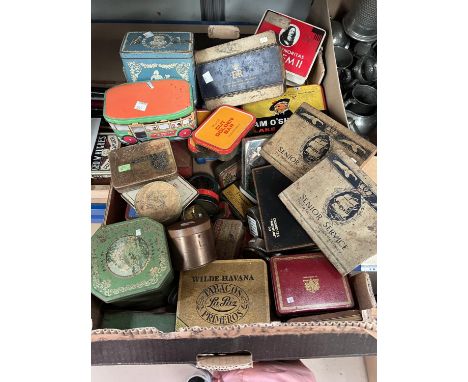 A collection of vintage advertising and commemorative tins of various sizes 