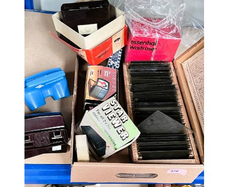 A cased set of 34 glass photographic slides showing people and places; a vintage Viewmaster Viewer, reels, one Bakelite and o