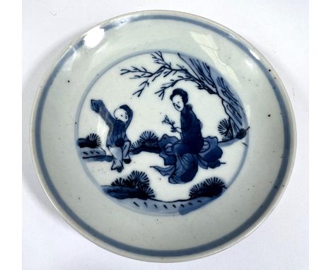 A Chinese, possibly Kangxi, blue and white miniature dish depicting a dancing boy, diameter 9cm. 