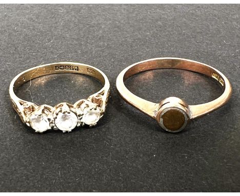 A 9 carat hallmarked gold ring set 3 clear stones, size K/L; a rose gold gem set ring, stamped '9ct', size P, 3.4gm 