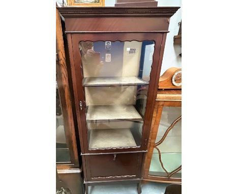 A late 19th/early 20th century mahogany display cabinet, tall slim proportions with reeded decoration to the single door, fal