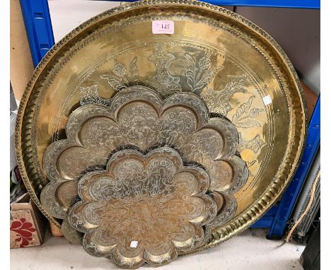 A large circular brass tray; an Edwardian mantel clock; a selection of brassware 
