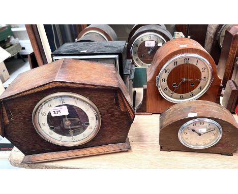 A 1930's mantel clock in oak case, with strike; 2 similar clocks; a small mantel clock 