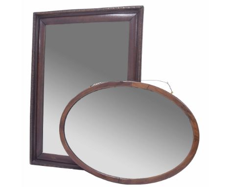 Mahogany cushion framed rectangular wall mirror, the bevelled glass within a carved motif border frame, 31" x 43"; together w