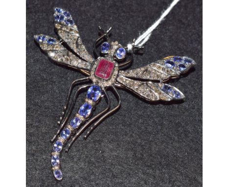 A diamond, ruby and  blue stone dragonfly brooch, yellow and white metal frame and mount, adjustable pin, unmarked, 77mm x 79