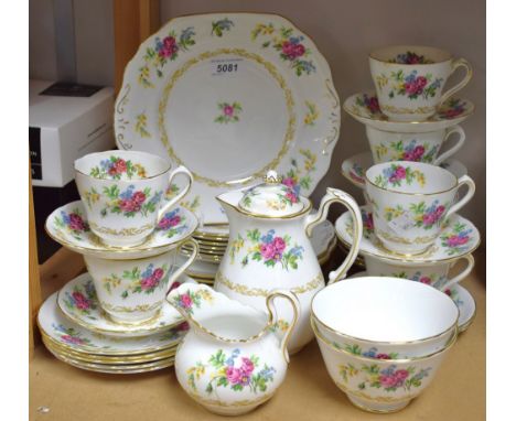 A Staffordshire Royal Chelsea part tea set, transfer printed with colourful summer flowers on a white ground, comprising cups