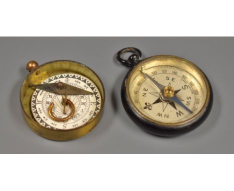 A 19th century brass compass; another