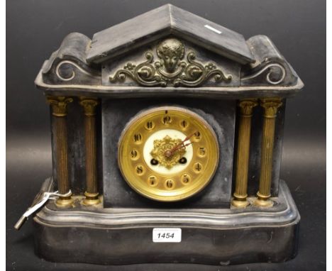 A late 19th century French black slate mantel clock