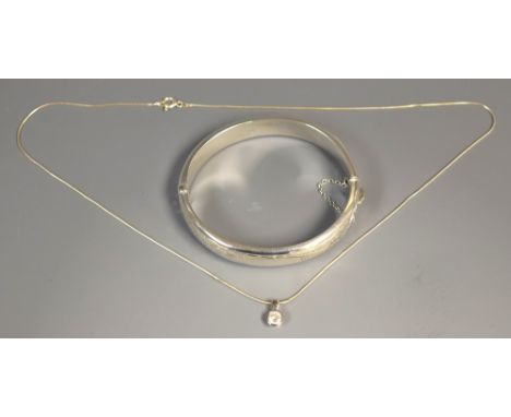 A silver hinged bangle, Chester 1960; a sterling silver pendant necklace, 24g gross 