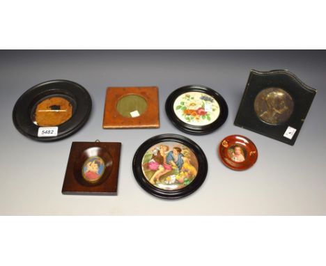 A late 19th century hand painted Berlin porcelain portrait miniature, maiden with basket of roses within circular Art Nouveau