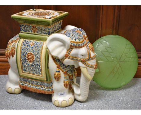 A pottery elephant jardiniere stand; an Art Deco green glass lamp shade (2) 