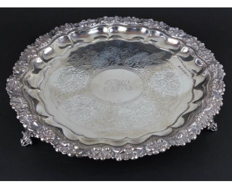 Silver Salver hallmarked Sheffield 1854, the centre having a monogram surrounded by a floral pattern on 3 raised feet approx.