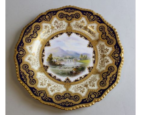 Royal Worcester porcelain plate, circa 1900, painted by E. Salter, signed, with a titled view of `Vale of Llangollen` within 
