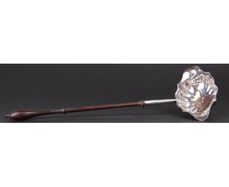 A George III silver toddy ladle with rosewood handle and hallmarked London 1773