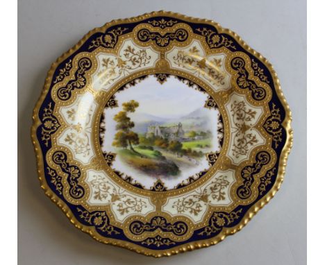 Royal Worcester porcelain plate, circa 1900, painted by E. Salter, signed, with a titled view of `Tintern Abbey` within a gil