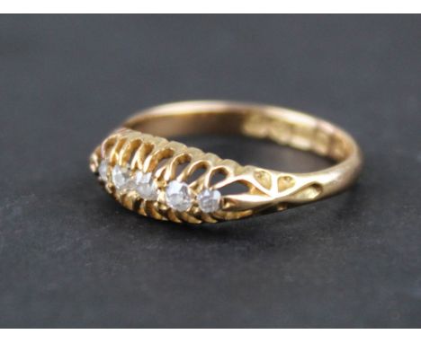 18ct Gold Ladies diamond set ring, the band set with a row of five small diamonds (hallmarked Chester 1906). size K