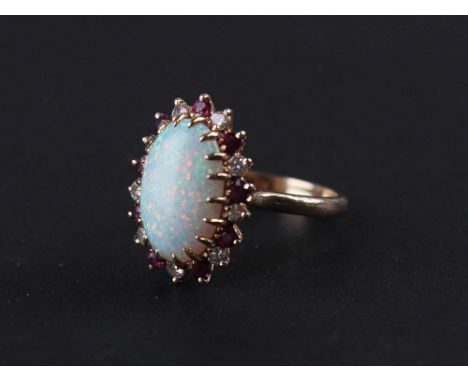 14kt Ladies Ring, Large Opal centre stone surrounded by Diamonds and Rubies size J weight 4.0 grams