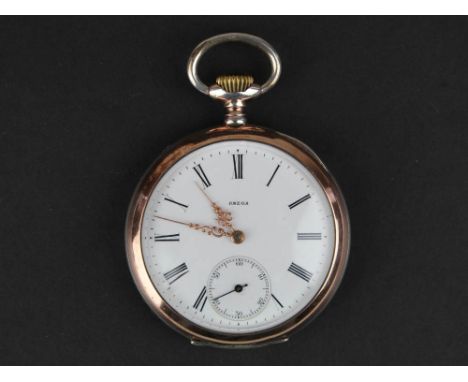 0.800 Silver Omega open face pocket watch, white enamel dial with second hand, ornate gilt hands and gold plated bezels.