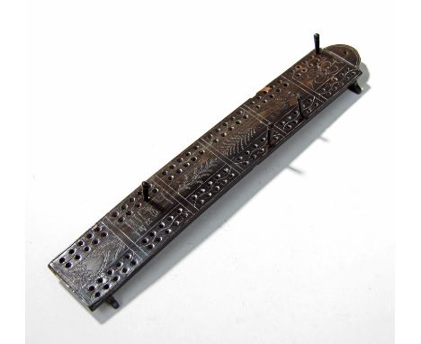 Fine George III period scrimshaw whale baleen cribbage board, the rectangular board with twin six rows of pierced holes, the 