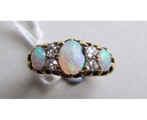 18 ct Ring set with Opal and Diamonds size O weight 4.0 grams