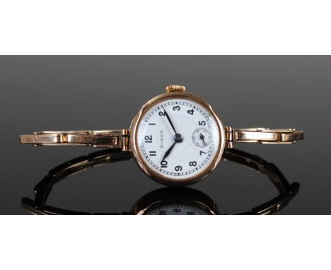 Rolex 9 carat gold ladies wristwatch with 9ct gold expandale bracelet, the white enamel dial having black roman numerals, bor