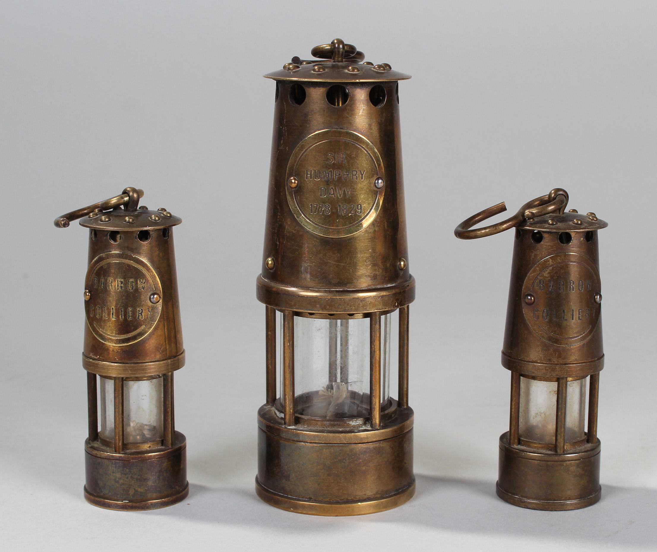 A Miniature Miners lamp commemorating Sir Humphry Davy 17781829 (12cm) and smaller pair entitled