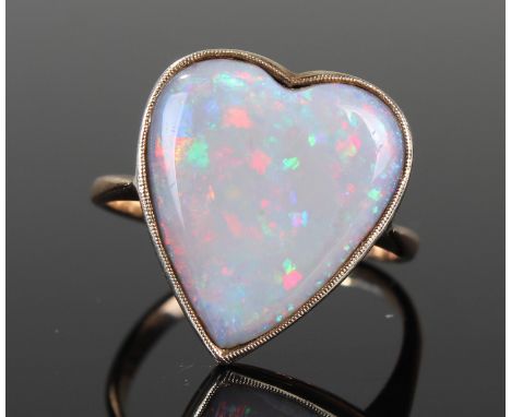 Yellow metal ring stamped 9ct with large Heart shaped opal size N weight 3.3 grams