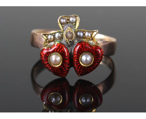 9 carat gold heart ring, with an applied pair of enamel hearts, with pearls on a ribbon, ring size R, 4.2 grams