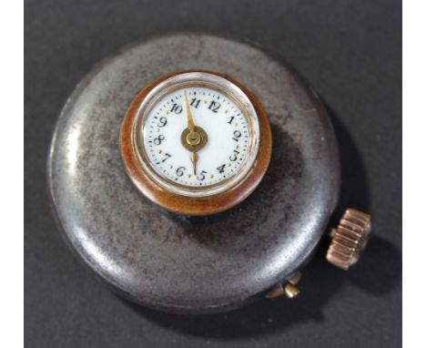 Novelty gun metal Button Hole watch with enamel face , arabic numerals spaced with yellow enamel dots, gilt hands, swiss move