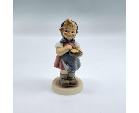 Hand painted figure of a young girl in a blue head scarf holding a bowl of something yummy. Goebel backstamp. Includes origin