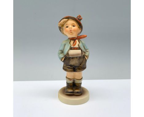 A young boy dressed in a blue jacket and brown pants with a matching hat. Matte finish. Goebel backstamp. Dimensions: 5.75"H 