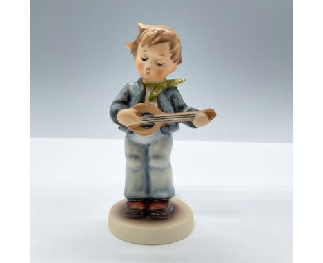 Matte finish. Features a little musician in blue clothes. Goebel Hummel backstamp. Includes the original box, dimensions: 3.7