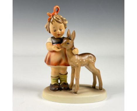 A matte hand painted figure portraying a girl feeding a deer from her palm. Goebel backstamp. M.I. Hummel. Issued: 1947Dimens