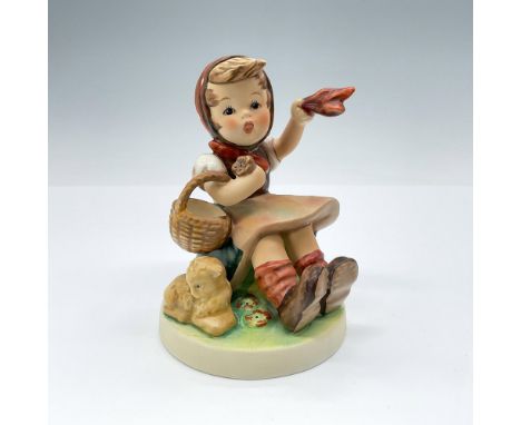 This figurine features a seated young girl waving her handkerchief and holding a basket. TMK#6. Goebel backstamp. Issued: 197