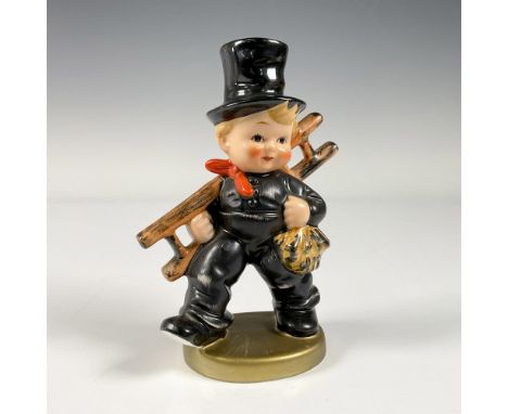 A hand painted figure of a boy wearing a black uniform and top hat, carrying a ladder. Goebel backstamp. Issued: 20th century