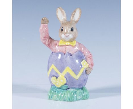 A figure of a bunny dressed in a pink button down and yellow bow tie, popping out a purple egg. Royal Doulton backstamp. Arti