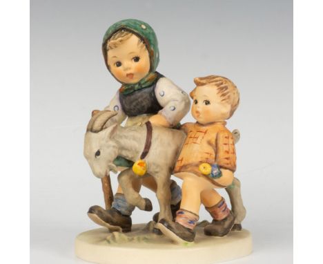 Presents a pair of pastoral children accompanied by a goat. Goebel Hummel backstamp. Issued: 1975Dimensions: 4.5''L x 3.5''W 