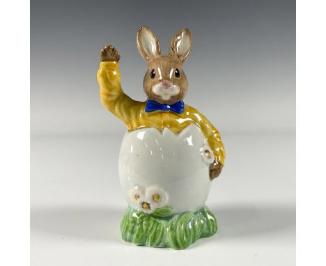 A figure of a bunny dressed in yellow button down and blue bow tie, popping out of a white egg. Royal Doulton backstamp. Arti