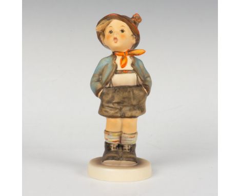 Hand painted porcelain with matte finish. Depicts a child dressed in brown and blue clothes with hands on his pockets. Goebel