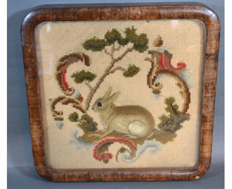 A Woolwork Tapestry with stump work rabbit amongst foliage within rosewood frame 32 x 32 cms 
