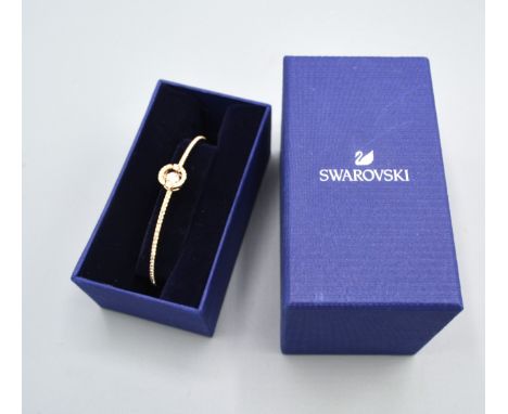 A Swarovski Sparkling Dance Bangle, gold plated with original box 
