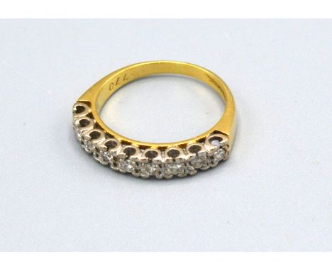 An 18ct Gold Half Eternity Ring set with nine diamonds within a pierced setting, ring size K, 3.3 gms 