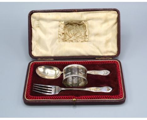 A Sheffield Silver Christening Spoon And Fork with engraved decoration together with a Sheffield silver napkin ring within fi