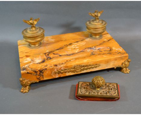 A French Variegated Marble And Gilt Metal Mounted Ink Stand with double inkwell raised upon paw feet 37 cms wide 