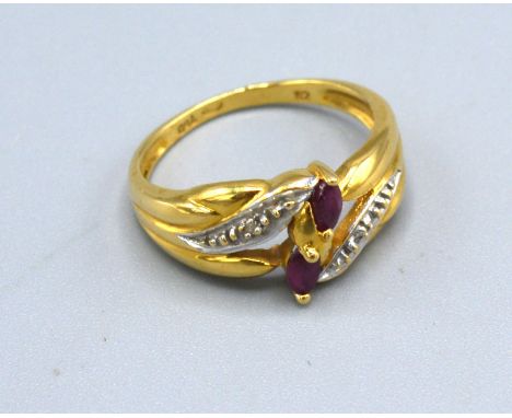 An 18ct Yellow Gold Diamond And Ruby Ring set with two rubies flanked by diamonds within a crossover setting, size L, 3 gms. 