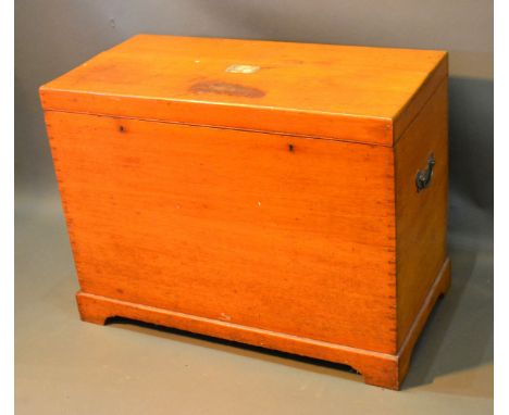A Late 19th Century Oak Silver Chest, the hinged top above a plain front with brass side end handles raised upon bracket feet